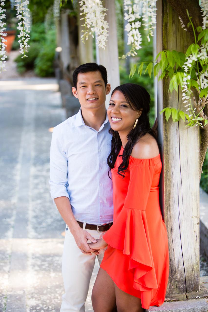 Couple portrait under wisteria